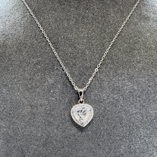 Diamond necklace on a textured gray surface