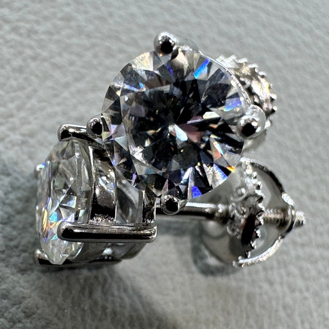 6.5mm moissanite studs detail showing brilliant fire sterling silver rhodium plated statement size