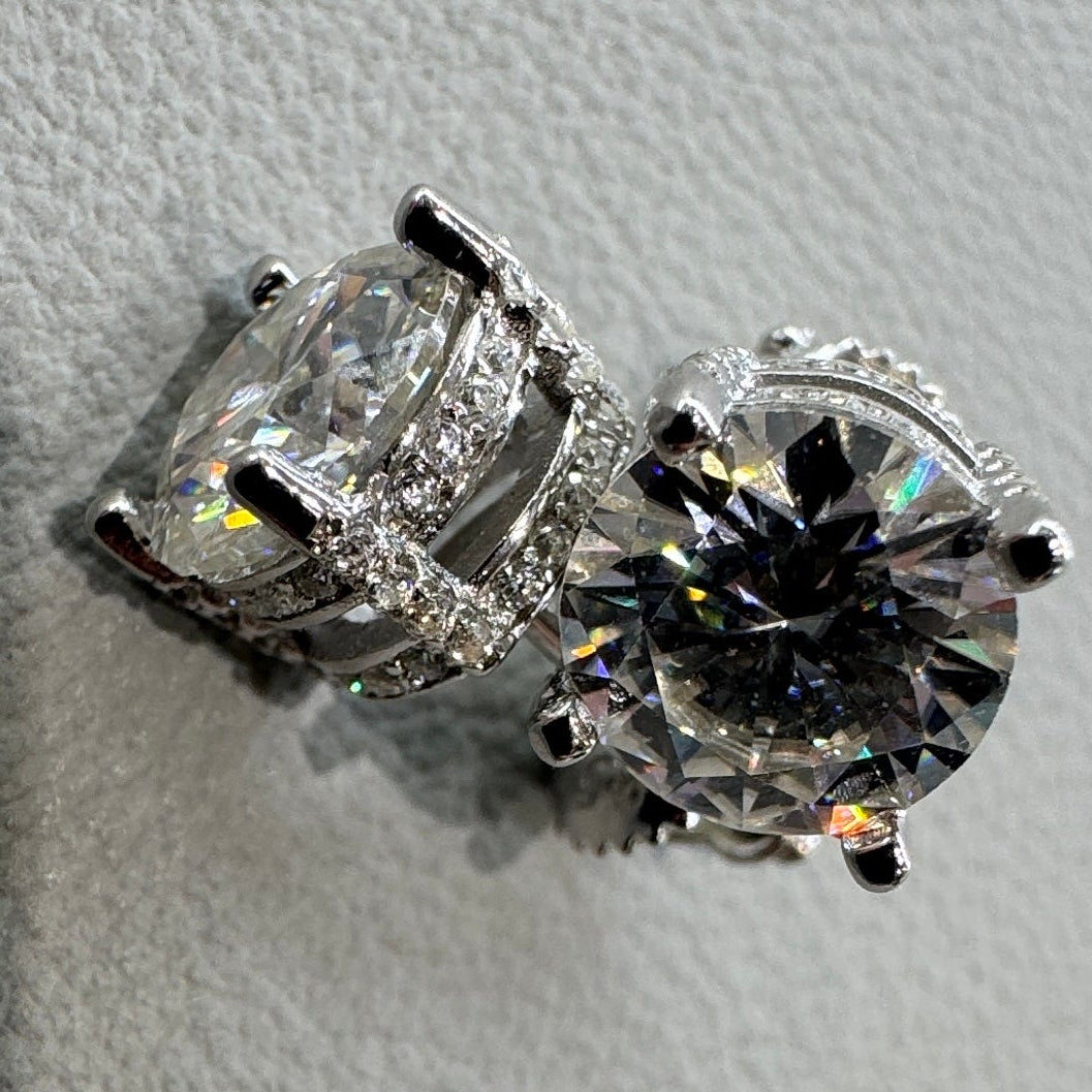 7.5mm moissanite studs detail showing accent stones halo design sterling silver rhodium plated luxurious finish