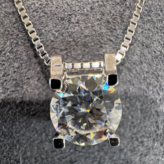 Diamond necklace on a textured gray background