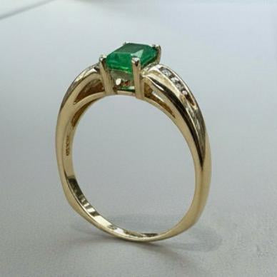 14K gold emerald ring detail showing emerald character expert craftsmanship