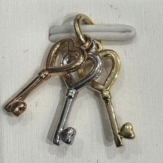 Pendant in tri-colors gold 10K key 1.49g / Bijouterie Del Moral