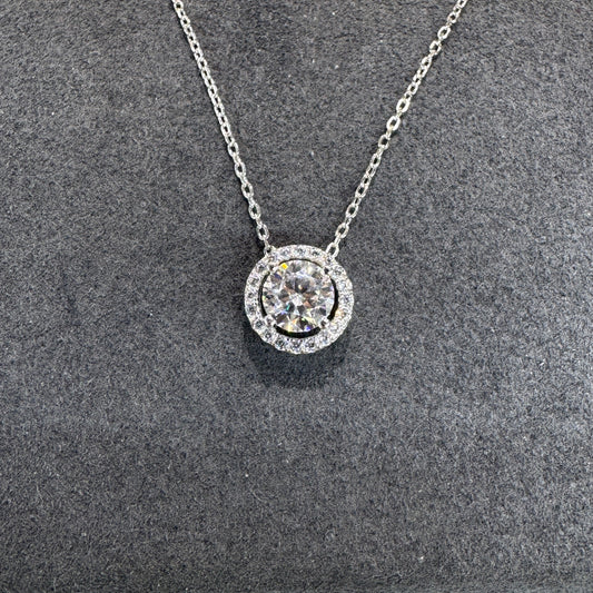 Sterling silver circular pendant detail showing 1ct moissanite stone brilliant fire Model MJE1098