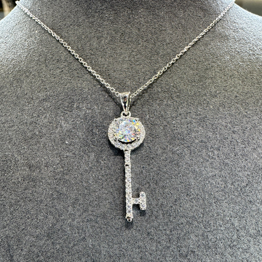 Sterling silver key pendant detail showing 1ct moissanite stone brilliant fire Model MJE1101