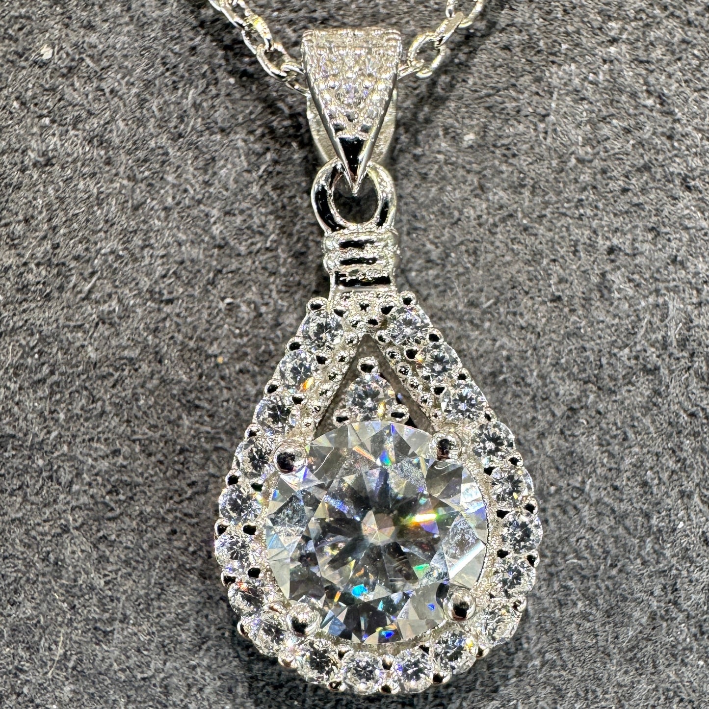 Sterling silver pear-shaped pendant detail showing 1ct moissanite stone brilliant fire and sparkle