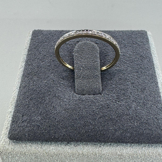 10K gold diamond ring detail showing expert setting delicate diamond brilliance
