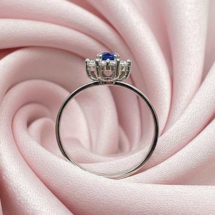 14K gold diamond sapphire ring detail showing expert setting blue sapphire and diamond brilliance
