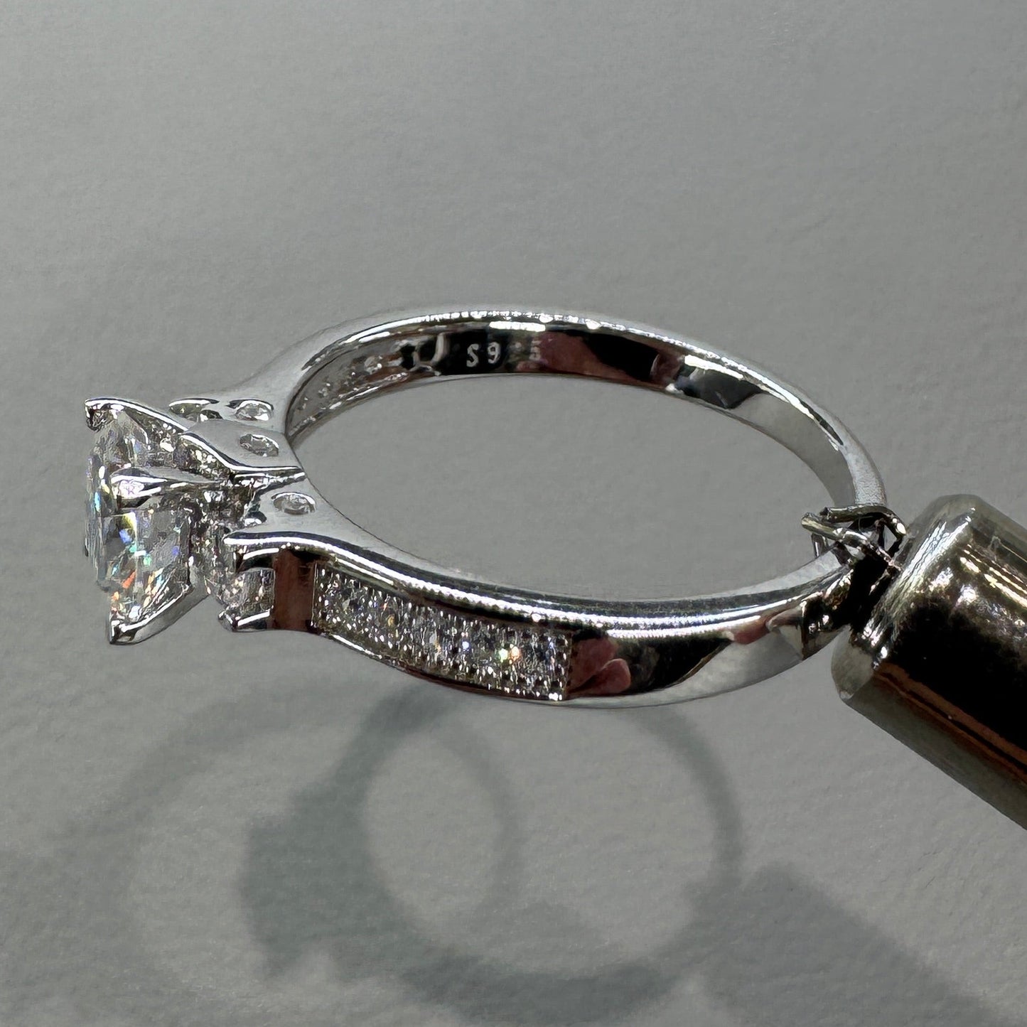 Sterling silver moissanite ring AZ063-J close-up showing brilliant stone and expert setting
