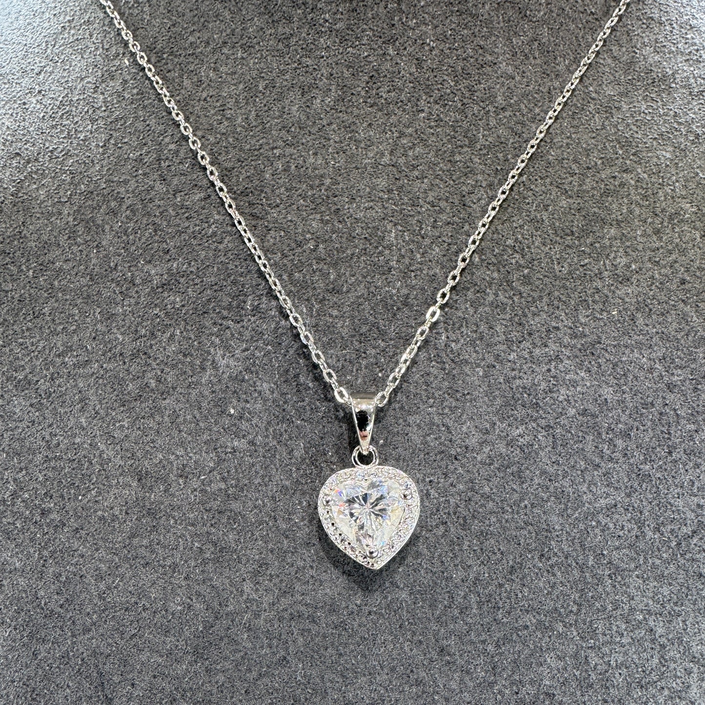 Diamond necklace on a textured gray surface