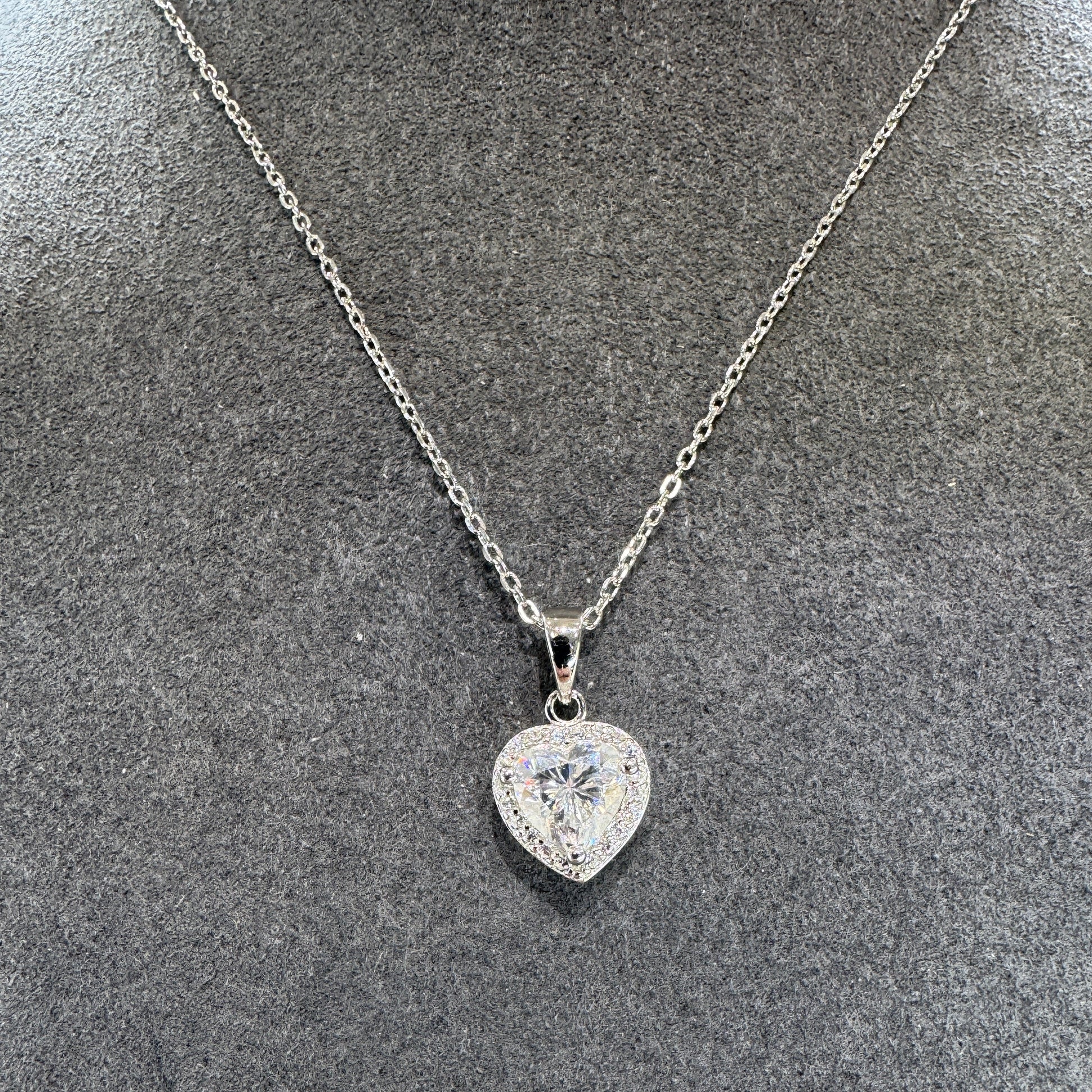 Diamond necklace on a textured gray surface