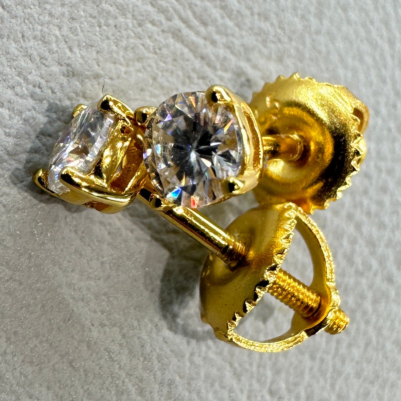 4mm moissanite studs detail showing brilliant fire sterling silver gold overlay luxurious finish
