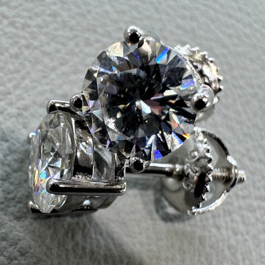 6.5mm moissanite studs detail showing brilliant fire sterling silver rhodium plated statement size
