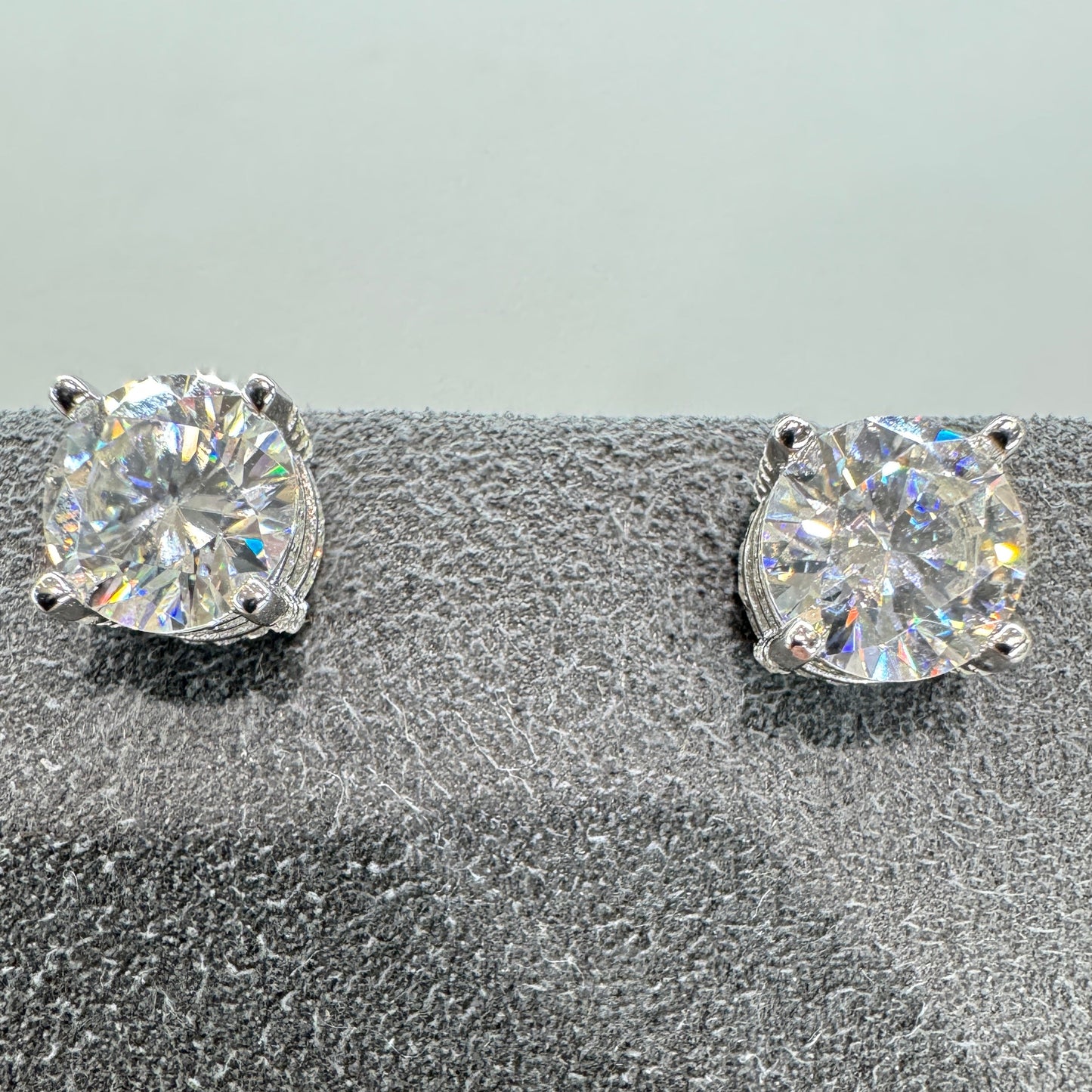 7.5mm moissanite stud earrings with accent stones sterling silver rhodium plated brilliant sparkle 1.5 carat equivalent halo effect
