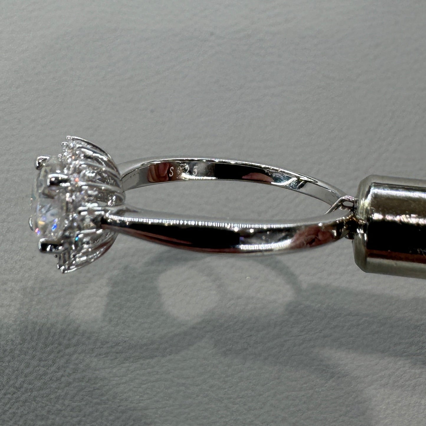 Sterling silver moissanite ring AZ012-J close-up showing brilliant gemstones and expert setting
