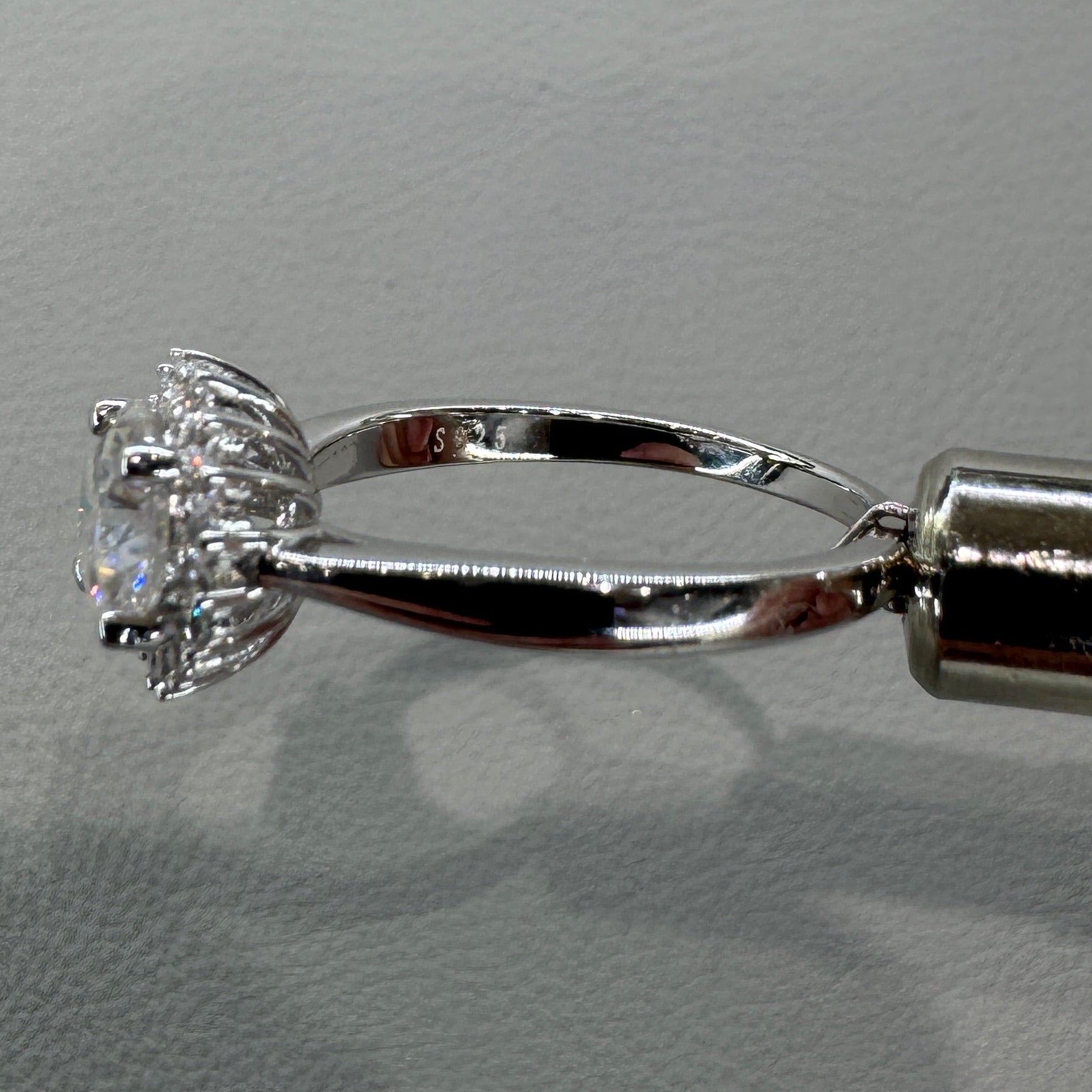 Sterling silver moissanite ring AZ012-J close-up showing brilliant gemstones and expert setting
