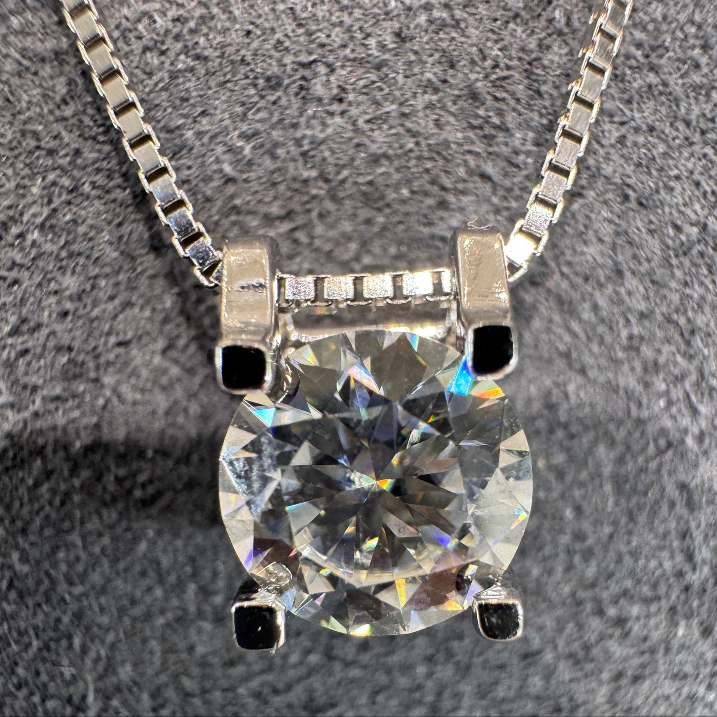 Diamond necklace on a textured gray background