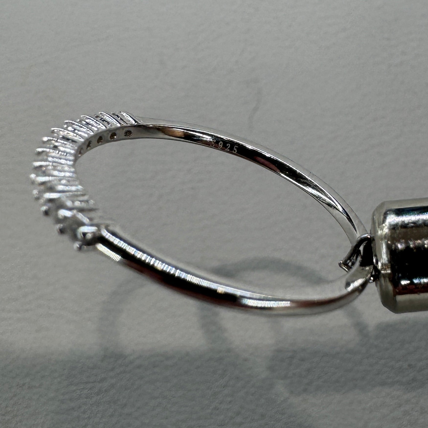 Sterling silver moissanite ring AZ064-J close-up showing brilliant stone and expert setting
