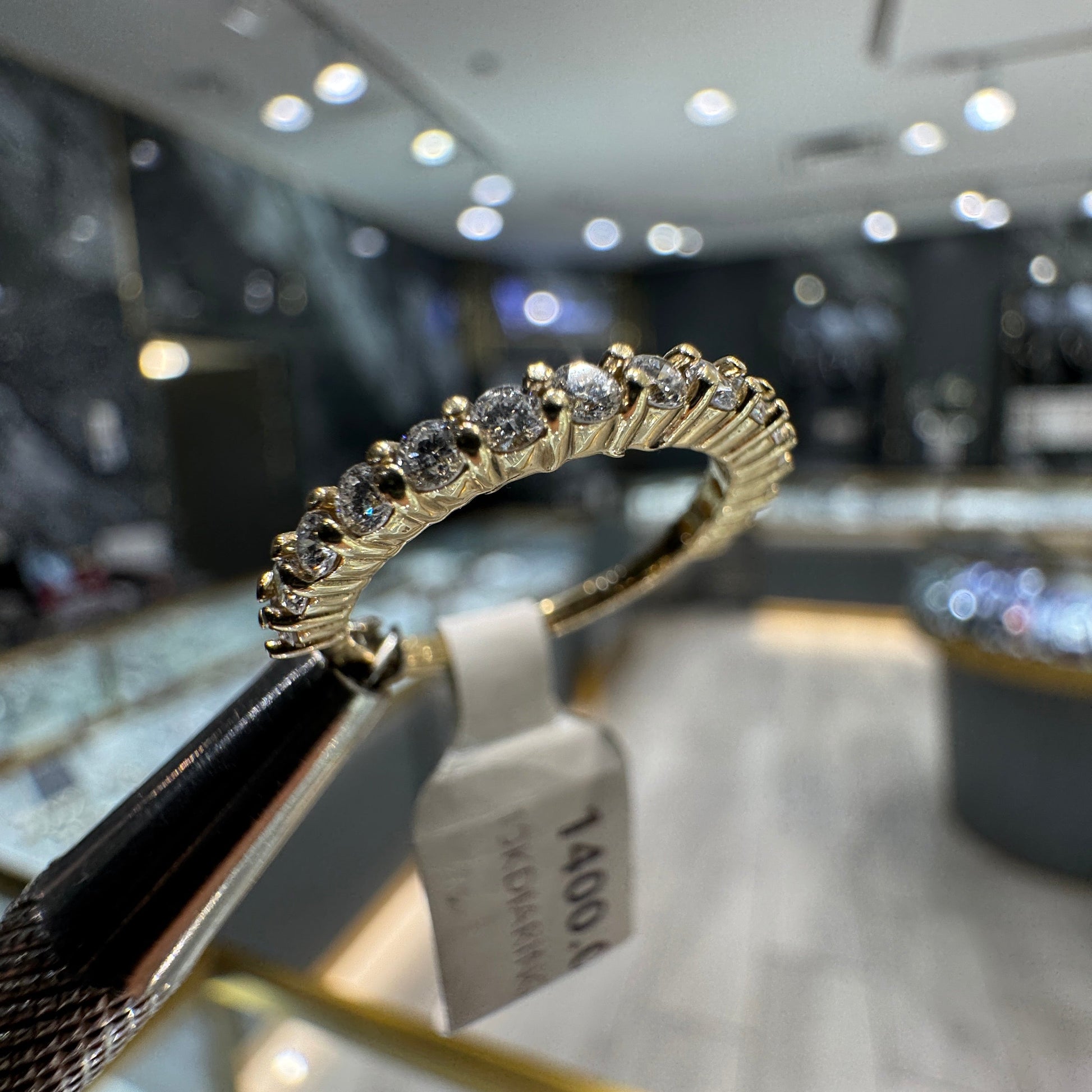 10K yellow gold diamond ring side view, semi-eternity design, complimentary sizing